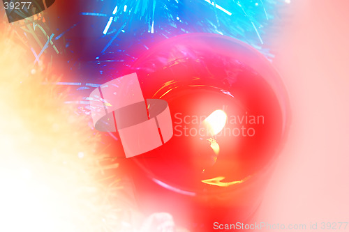 Image of Blured candle and Christmas decoration
