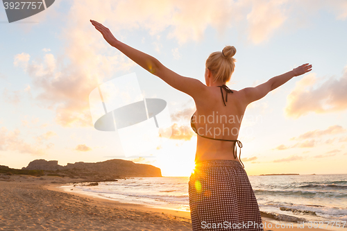 Image of Free Happy Woman Enjoying Sunset on Sandy Beach