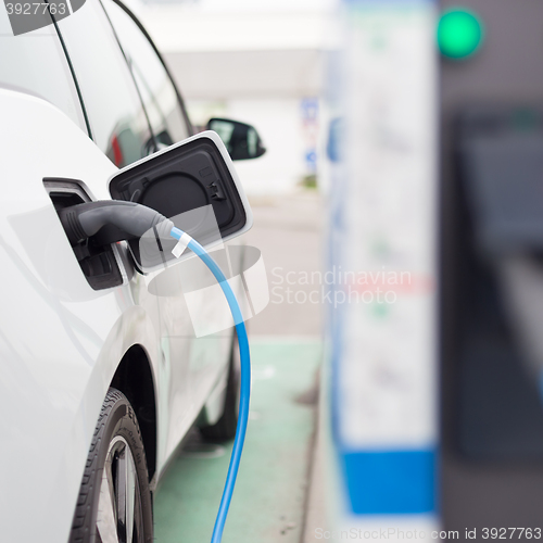 Image of Electric Car in Charging Station.