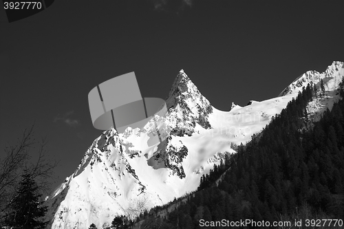 Image of Black and white mountain peak in snow