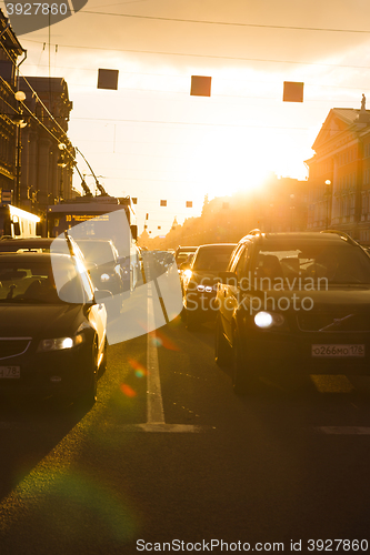 Image of the cars and the trolley are on the traffic light