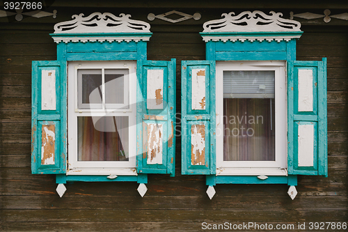 Image of old window with carved architraves