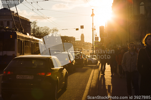 Image of the cars and the trolley are on the traffic light