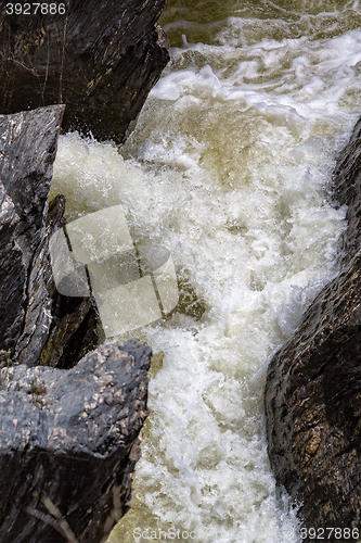 Image of Waterfall Flowing Between the Lava Stones