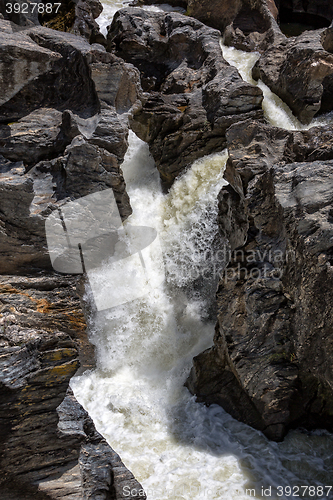 Image of Waterfall Flowing Between the Lava Stones