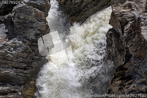 Image of Waterfall Flowing Between the Lava Stones