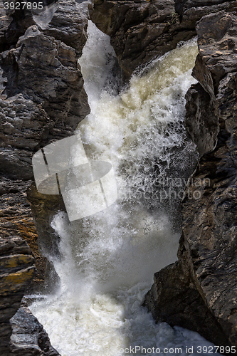 Image of Waterfall Flowing Between the Lava Stones