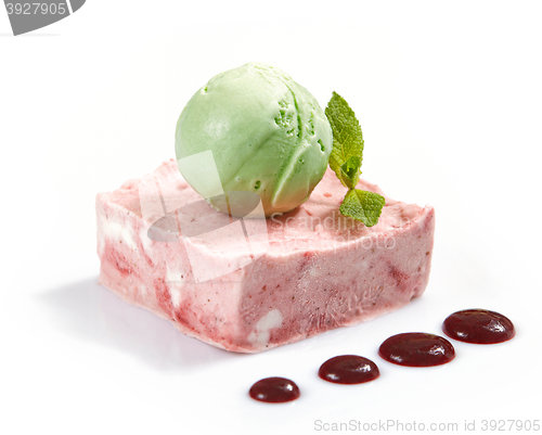 Image of pink fruit cream with green icecream