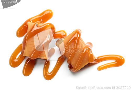 Image of caramel candies on white background