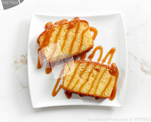 Image of biscuit cake decorated with caramel sauce