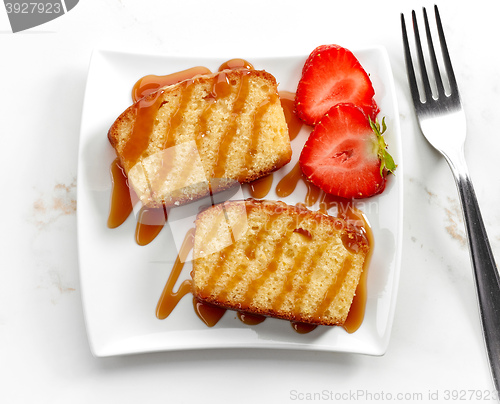 Image of biscuit cake slices decorated with caramel sauce