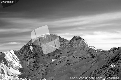 Image of Black and white high mountains in evening