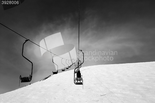 Image of Black and white old chair-lift in ski resort