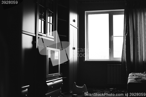 Image of fragment of living room in black and white