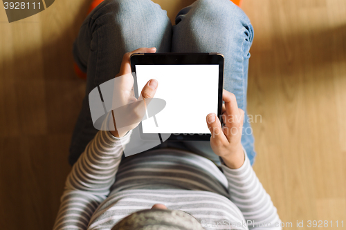 Image of woman working on tablet