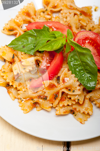 Image of Italian pasta farfalle butterfly bow-tie and tomato sauce