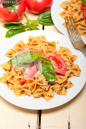 Image of Italian pasta farfalle butterfly bow-tie and tomato sauce