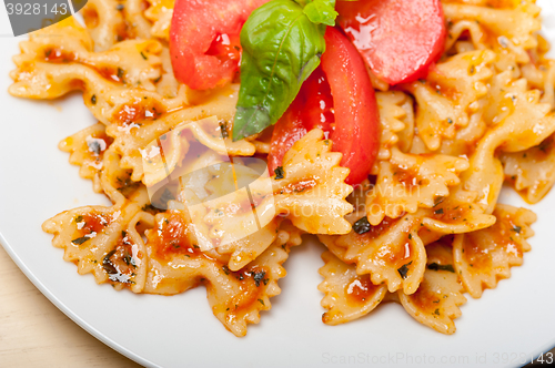 Image of Italian pasta farfalle butterfly bow-tie and tomato sauce