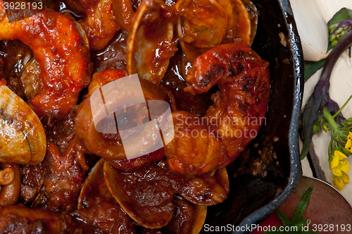 Image of fresh seafoos stew on an iron skillet