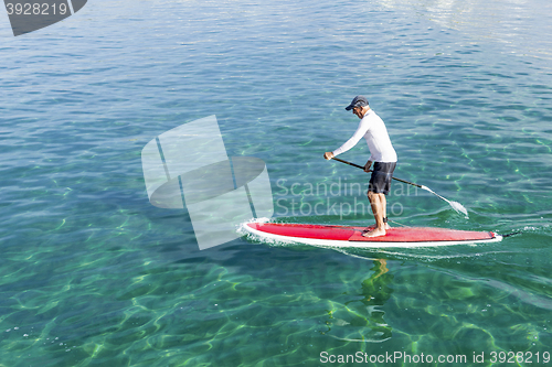 Image of Senior man practicing paddle