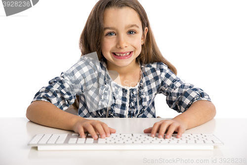 Image of Little girl working with a computer