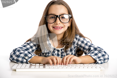 Image of Little girl working with a computer