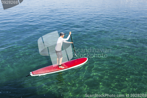 Image of Senior man practicing paddle