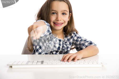 Image of Little girl working with a computer