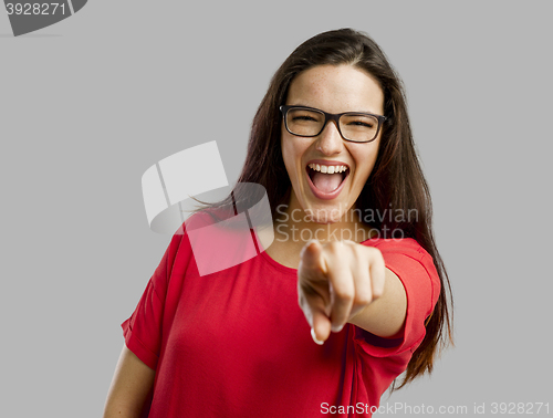 Image of Happy woman pointing to the camera