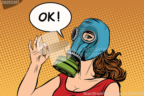 Image of Young woman in gas mask okay gesture