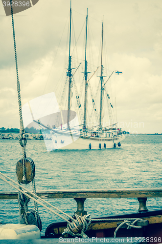 Image of Old sailboat in the harbor, toning