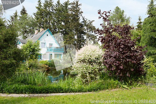 Image of Beautiful house in spring garden