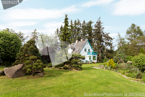 Image of Beautiful house in spring garden