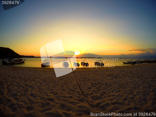 Image of Nusa penida, Bali beach with dramatic sky and sunset