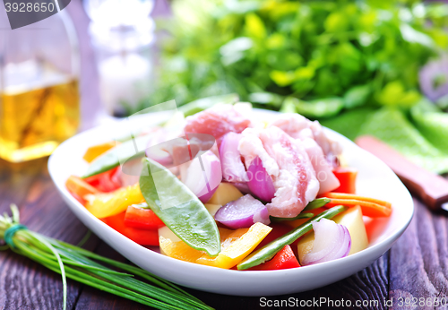 Image of raw meat with vegetables