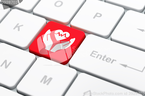 Image of Insurance concept: Heart And Palm on computer keyboard background