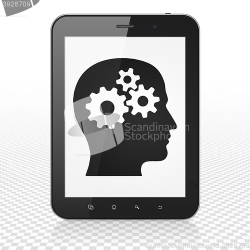 Image of Information concept: Tablet Computer with Head With Gears on display