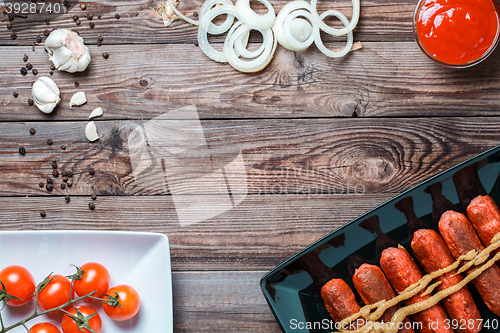 Image of Sausage roasted on the grill.