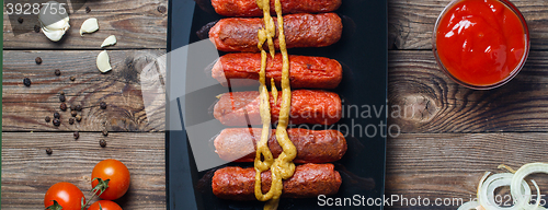 Image of Sausage roasted on the grill.