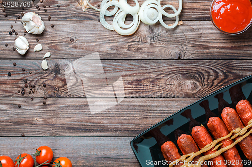 Image of Sausage roasted on the grill.