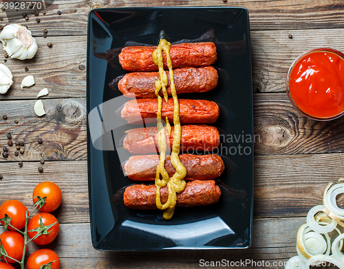 Image of Sausage roasted on the grill.