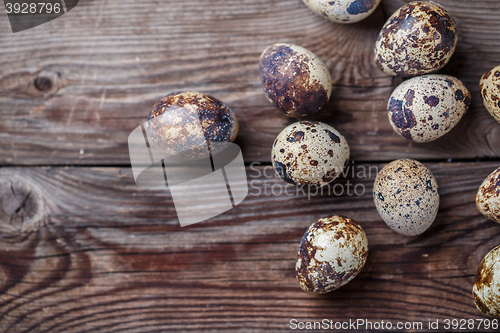 Image of Group of quail eggs on thewooden background