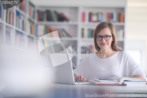 Image of female student study in school library