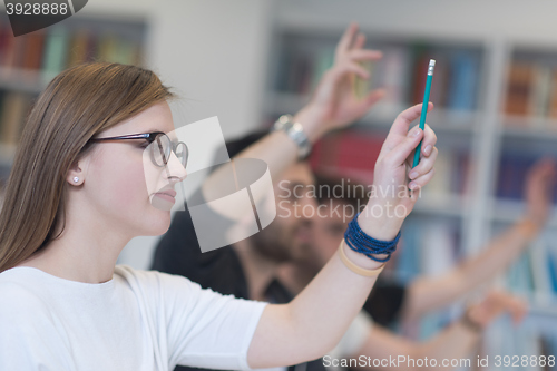 Image of group of students  raise hands up