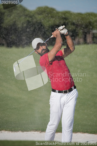 Image of golfer hitting a sand bunker shot