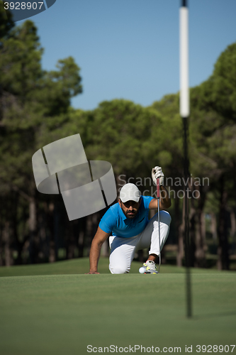 Image of golf player aiming perfect  shot