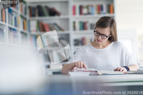 Image of female student study in school library