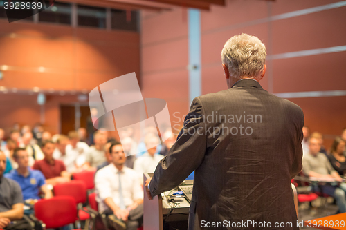 Image of Speaker at Business Conference and Presentation.