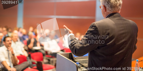 Image of Speaker at Business Conference and Presentation.