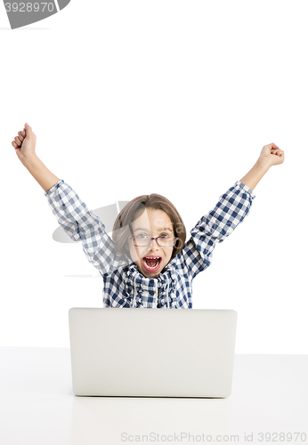 Image of Little girl working with a laptop